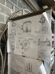 exploded drawings pinned on presentation board